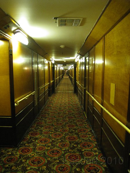 Queen Mary 2010 0395.JPG - The longest shipboard hall way ever? 700 feet? Has a curve in it of 10 feet, so if you stand at one end you cannot see the other end.